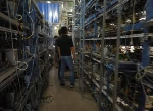 A mining farm equipped with numerous mining rigs dedicated to Bitcoin mining.